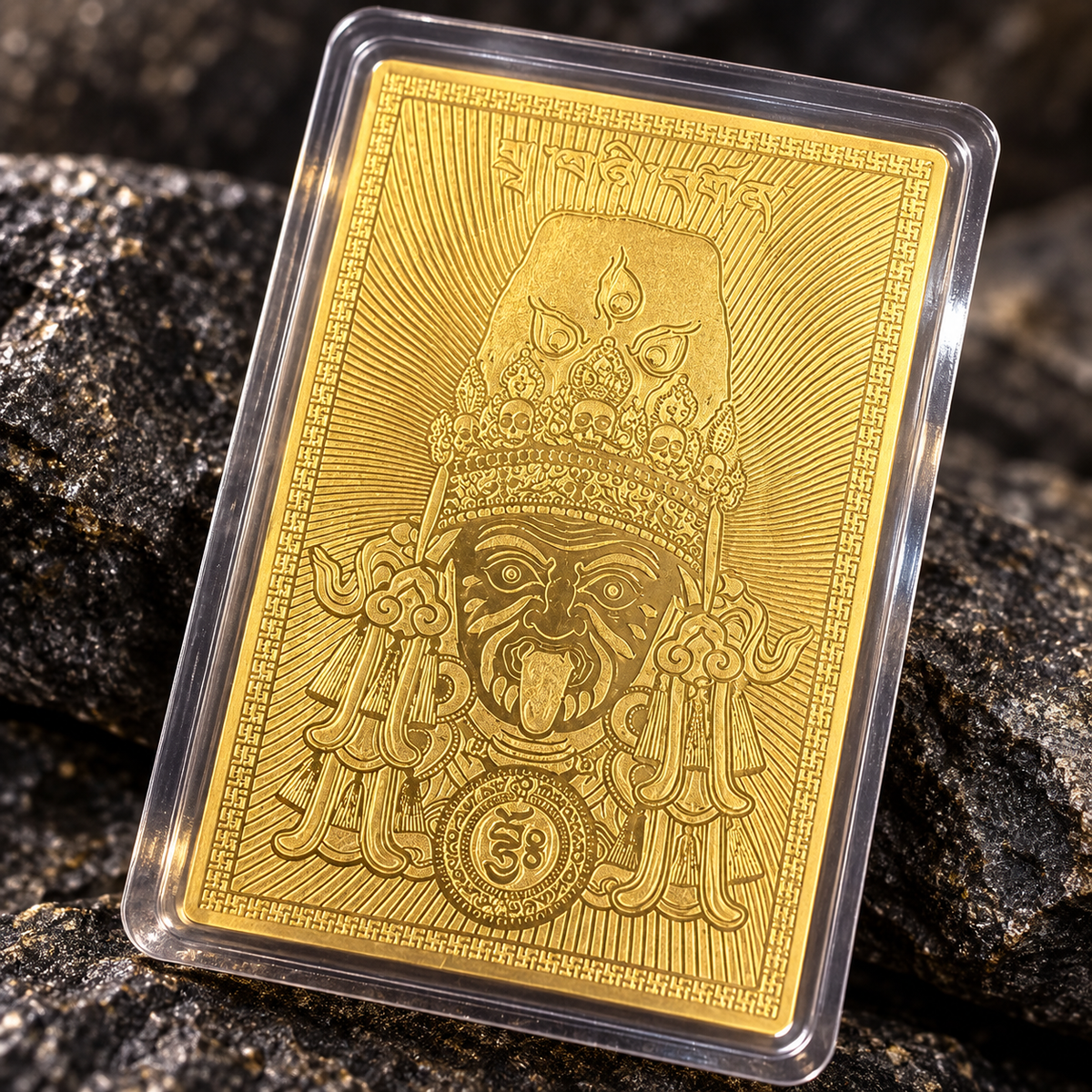 Close-up of the engraved Zaki Lhamo design on a gold-tone card in a clear case